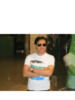 a man wearing sunglasses and a t-shirt that says " freedom "