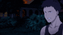 a man in a black tank top is looking at something