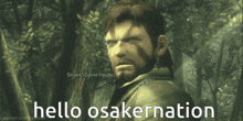 a man with a beard is standing in a forest with the words hello osakernation below him
