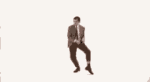 mr bean is dancing in the air with his arms outstretched .