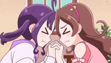 two anime girls are looking at each other and one has a headband with a note on it