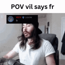 a man with long hair is sitting in front of a screen that says pov vil says fr at the top