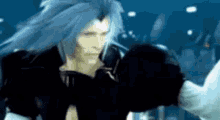 a man with long blue hair is standing in a dark room holding a sword .