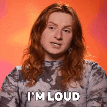 a man with long red hair says " i 'm loud "