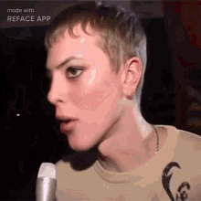 a close up of a person talking into a microphone with the words made with reface app visible