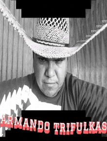 a man wearing a cowboy hat and a shirt that says armando trifulkas