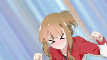 a girl in a red and white jacket is making a funny face