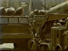 a row of military vehicles are parked in a line