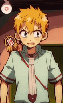 a boy with yellow hair is wearing a tie and holding a piece of paper with chinese writing on it