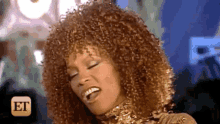 a close up of a woman 's face with the word et in the corner