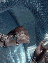 a close up of a person 's hand with a bracelet that says kiiseru on it