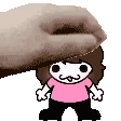 a hand is putting a cartoon character on top of a cartoon character .