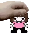 a hand is putting a cartoon character on top of a cartoon character .
