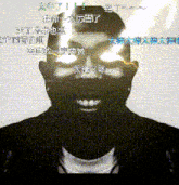 a black and white photo of a man with chinese writing around his head