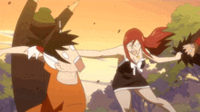 a woman with red hair is standing next to a man with a hat
