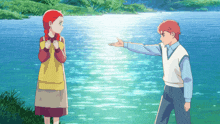 a boy and a girl are standing in front of a lake