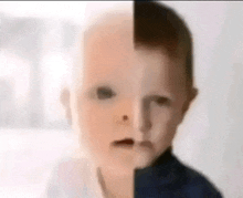 a baby 's face is split in half , one half is white and the other half is dark .
