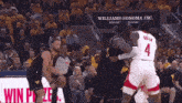a basketball game is being played in front of a sign that says williams sonoma inc.