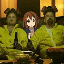 two men in yellow jackets are sitting on a couch with a picture of a girl on the wall behind them .