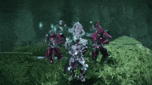 a group of warriors are standing in a grassy area