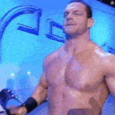 a man without a shirt is standing in front of a sign that says lc