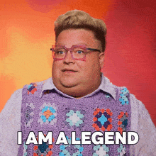 a fat man wearing glasses and a purple sweater says i am a legend