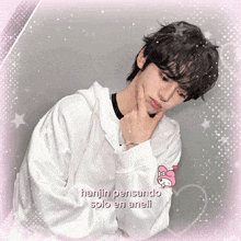 a picture of a young man with the words hanjin pensando solo en aneli on it
