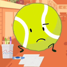 a tennis ball with arms and legs is holding a crayon