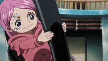 a little girl with pink hair and blue spots on her face