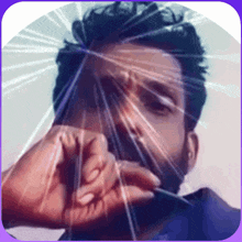 a man with a beard is looking through a broken glass window