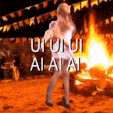 a woman dancing in front of a fire with the words " ui ui ai ai ai " on the bottom