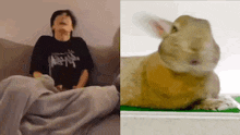 a man is sitting on a couch next to a rabbit laying on a table .