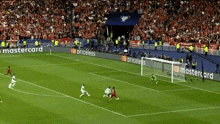 a soccer game is being played in a stadium with ads for mastercard and priceless on the sidelines