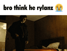 a picture of a man holding a gun with the words bro think he rylanz above him