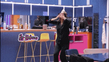 a woman wearing a tiara is dancing in a room with the words by helena on the bottom right