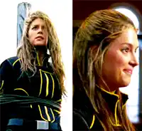 a woman in a black and yellow outfit is tied up