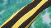 a close up of a yellow and black striped item