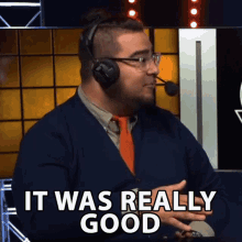 a man wearing headphones and a tie says it was really good
