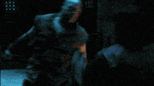a man with a tattoo on his arm kicks another man in the face
