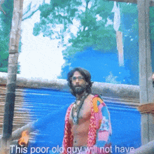 a shirtless man stands in front of a blue wall with the words " this poor old guy will not have "