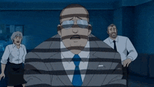 a man in a suit is laying on the ground while another man stands in the background