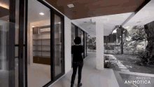 a woman is walking through a hallway with sliding glass doors made by animatica