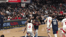 a basketball game is being played in front of a venture global ad
