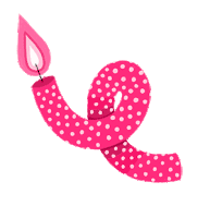 a pink birthday candle with white polka dots