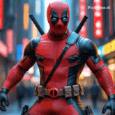 a man in a deadpool costume is standing in a city