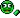 a green pixel art smiley face with a green arrow pointing to the left .