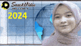 a woman wearing a hijab is smiling in front of a sign that says 2024