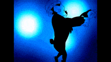 a silhouette of a person with a blue background