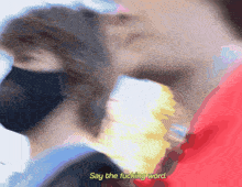 a blurry image of a person with the words say the fucking word in yellow