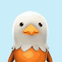 a stuffed eagle with an orange beak is looking at the camera on a blue background .